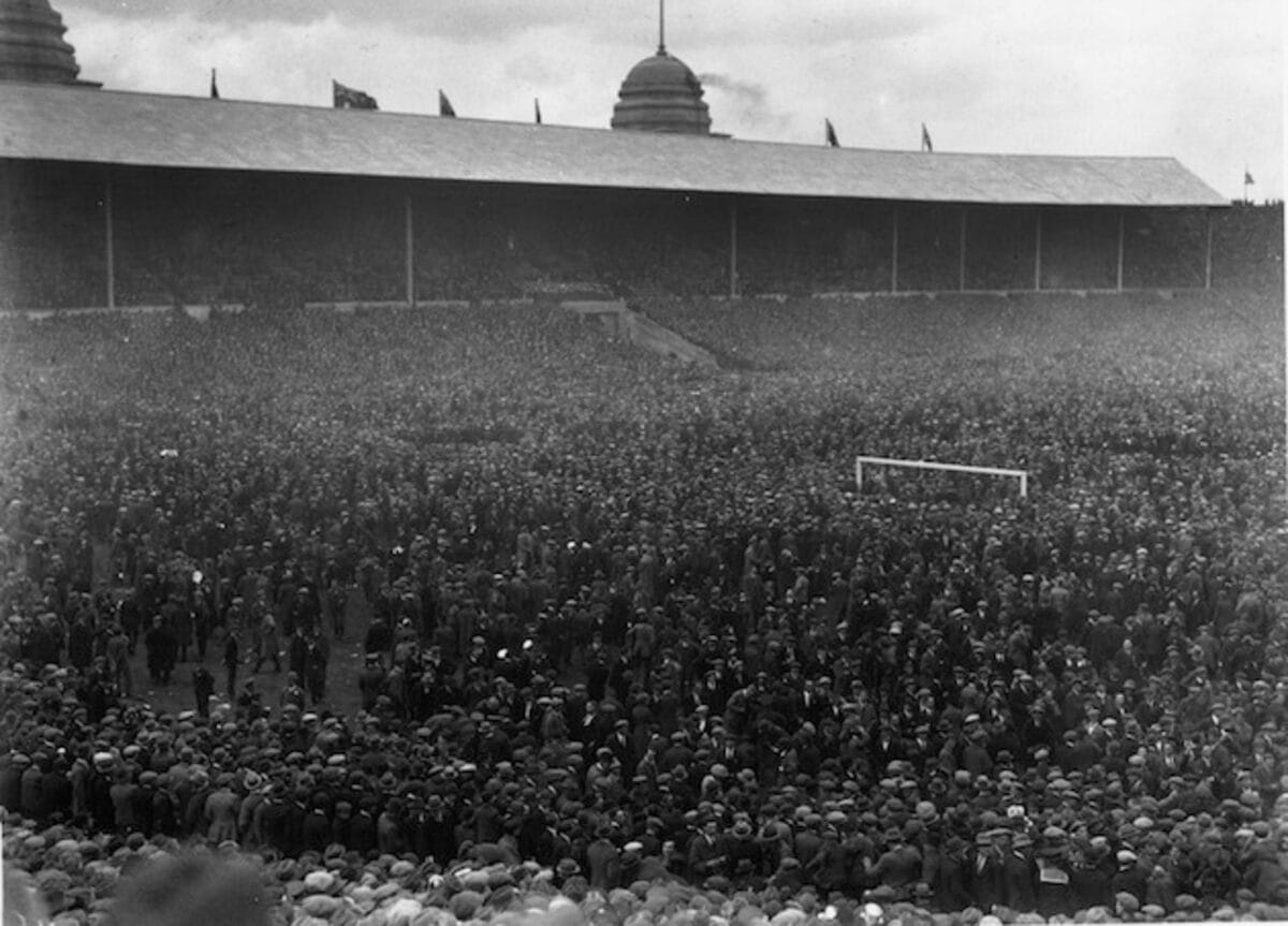 The crowd spills on to the pitch during the 1923 FA Cup final between Bolton Wanderers and West Ham United