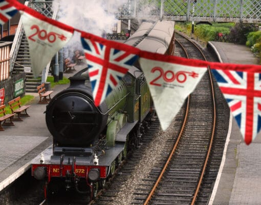 Steam locomotive with bunting in foreground