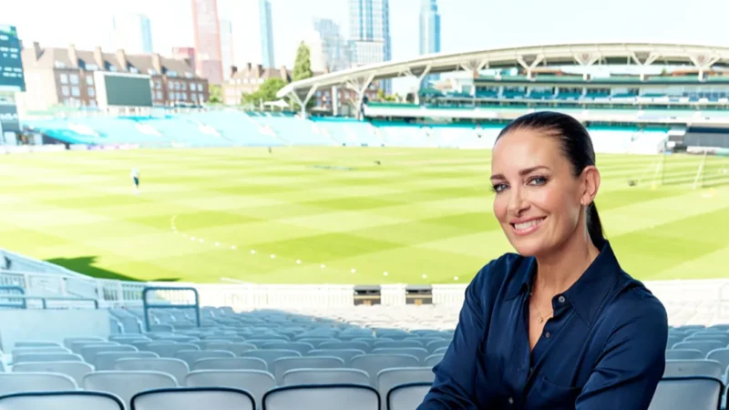 Kirsty Gallagher smiling while sitting in a stadium