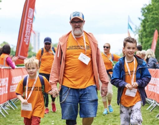Man and two boys on fundraising walk