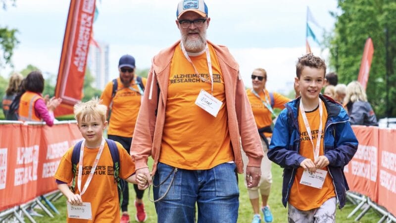 Man and two boys on fundraising walk