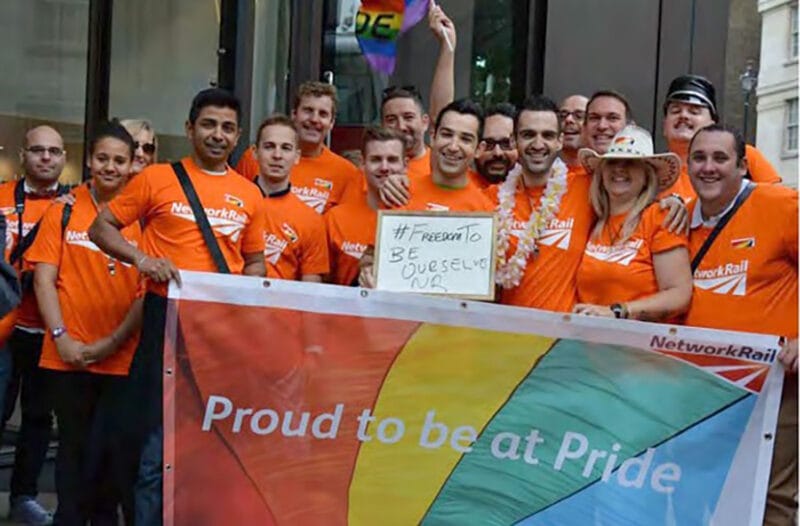 Network Rail group in orange shirts at Pride 2014