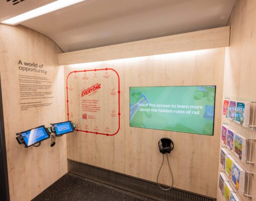 Interior of 'future' carriage of Railway 200 exhibition train showing 2 tablets and touchscreen
